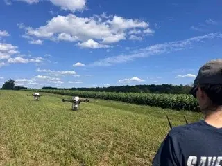 Swift Aeroseed team next to a LeadingEdge PV40X agricultural drone in Pennsylvania